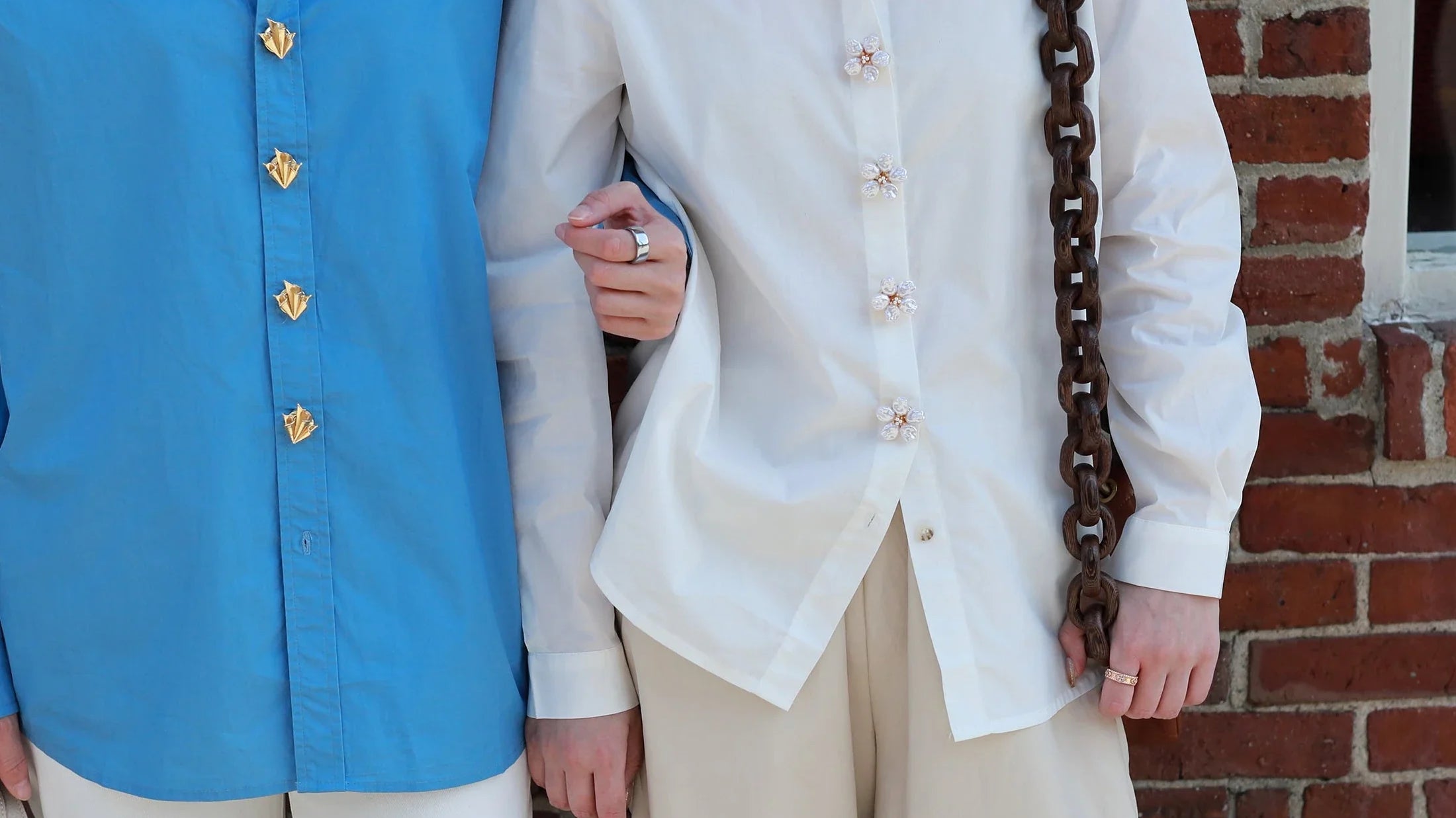 two models with shirts and button vena signature button covers