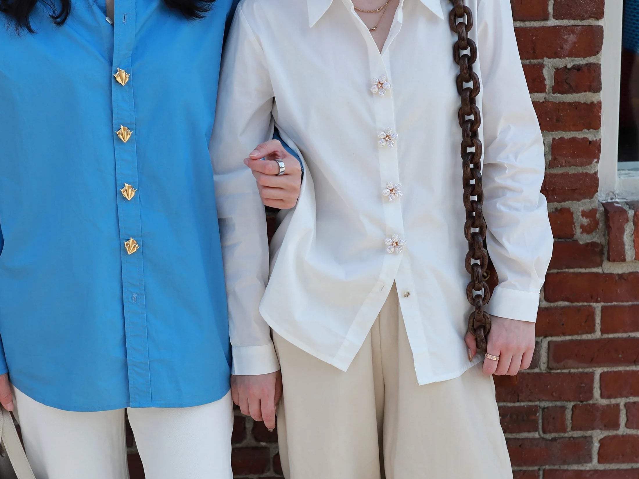 two models with shirts and button vena signature button covers