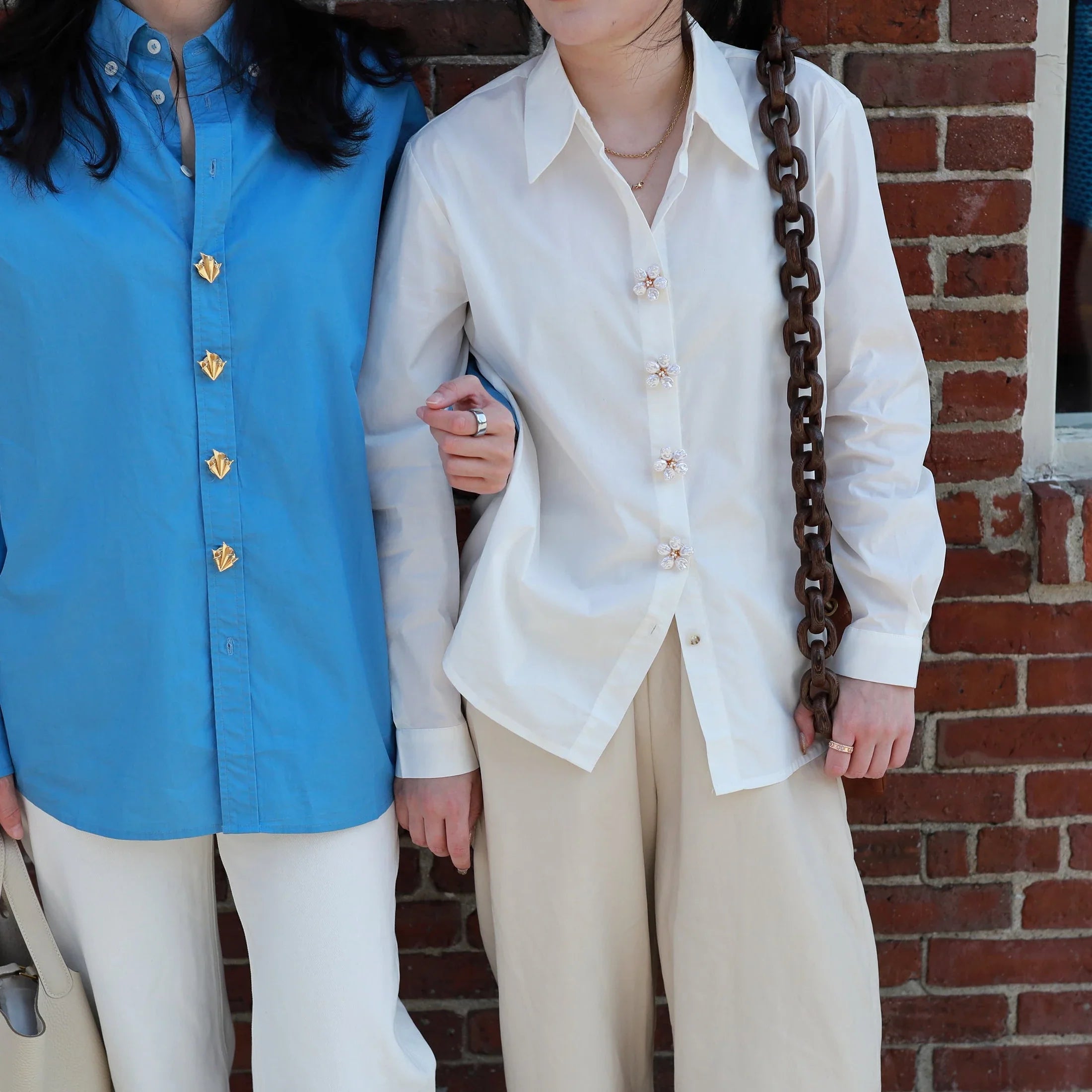 two models with shirts and button vena signature button covers