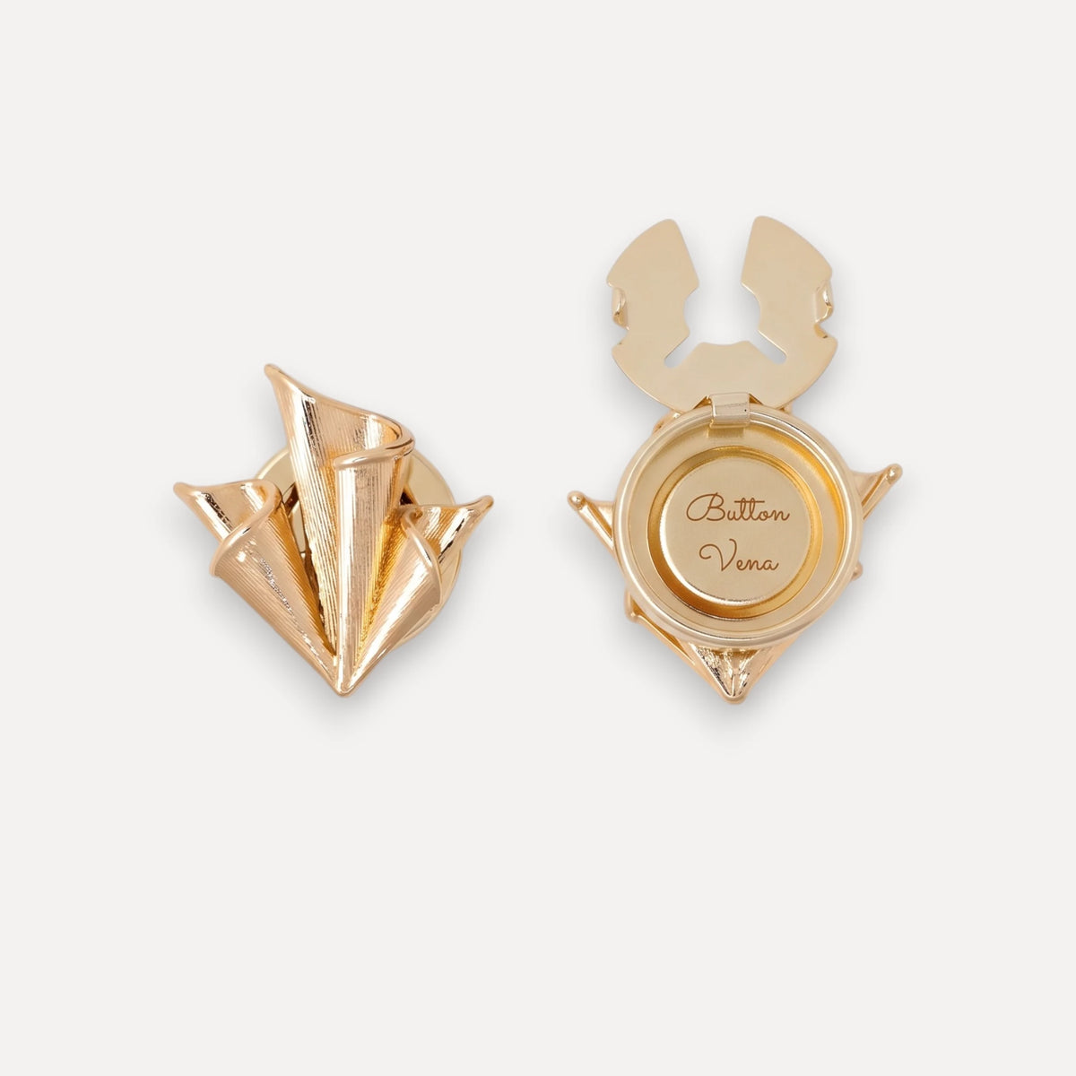 A pair of Foulard 22K gold-plated clip-on button cover on a light gray background, showing both the front folded design and the back circular clasp with the brand name 'Button Vena' engraved.