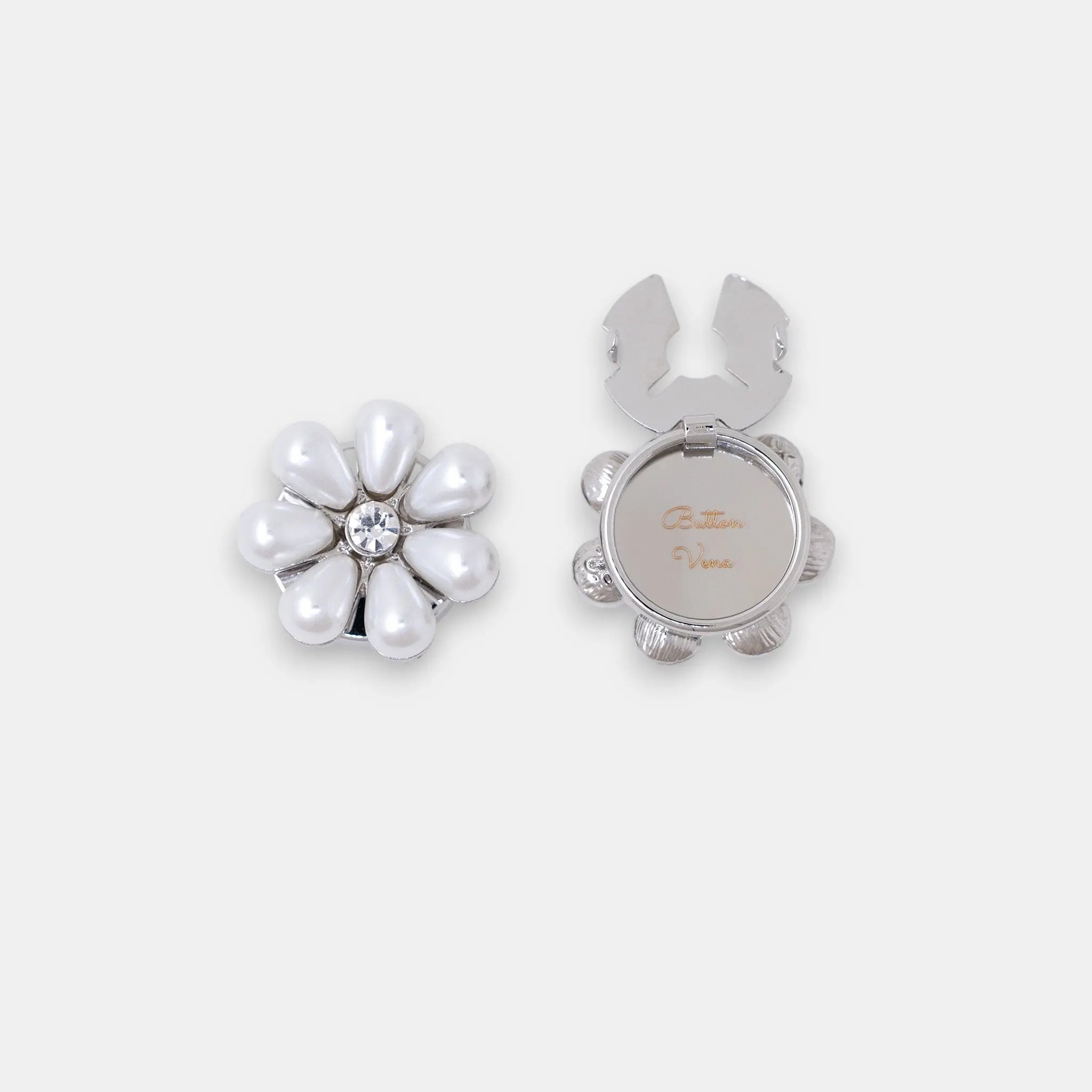 The Maya silver seven-petal teardrop pearl clip-on button cover with a rhinestone center