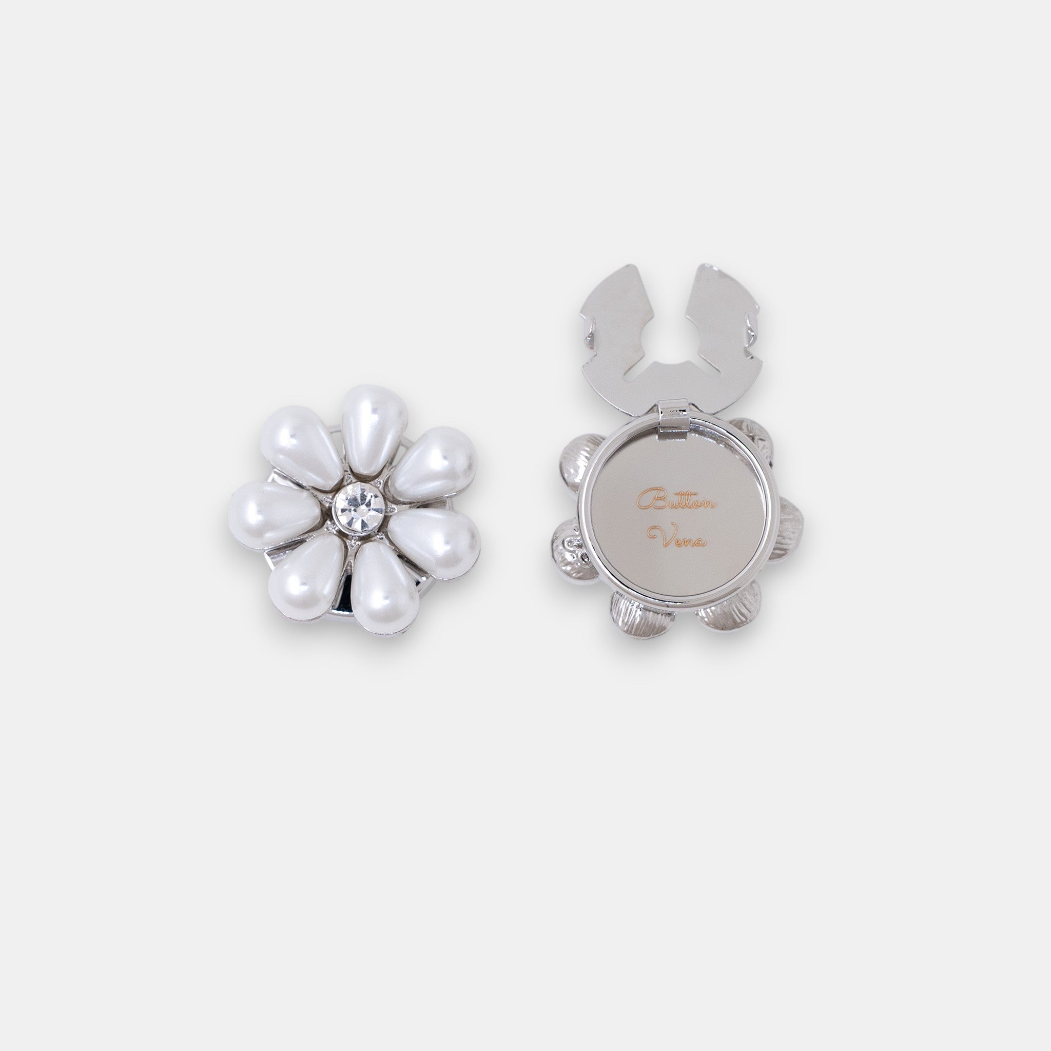 The Maya silver seven-petal teardrop pearl clip-on button cover with a rhinestone center