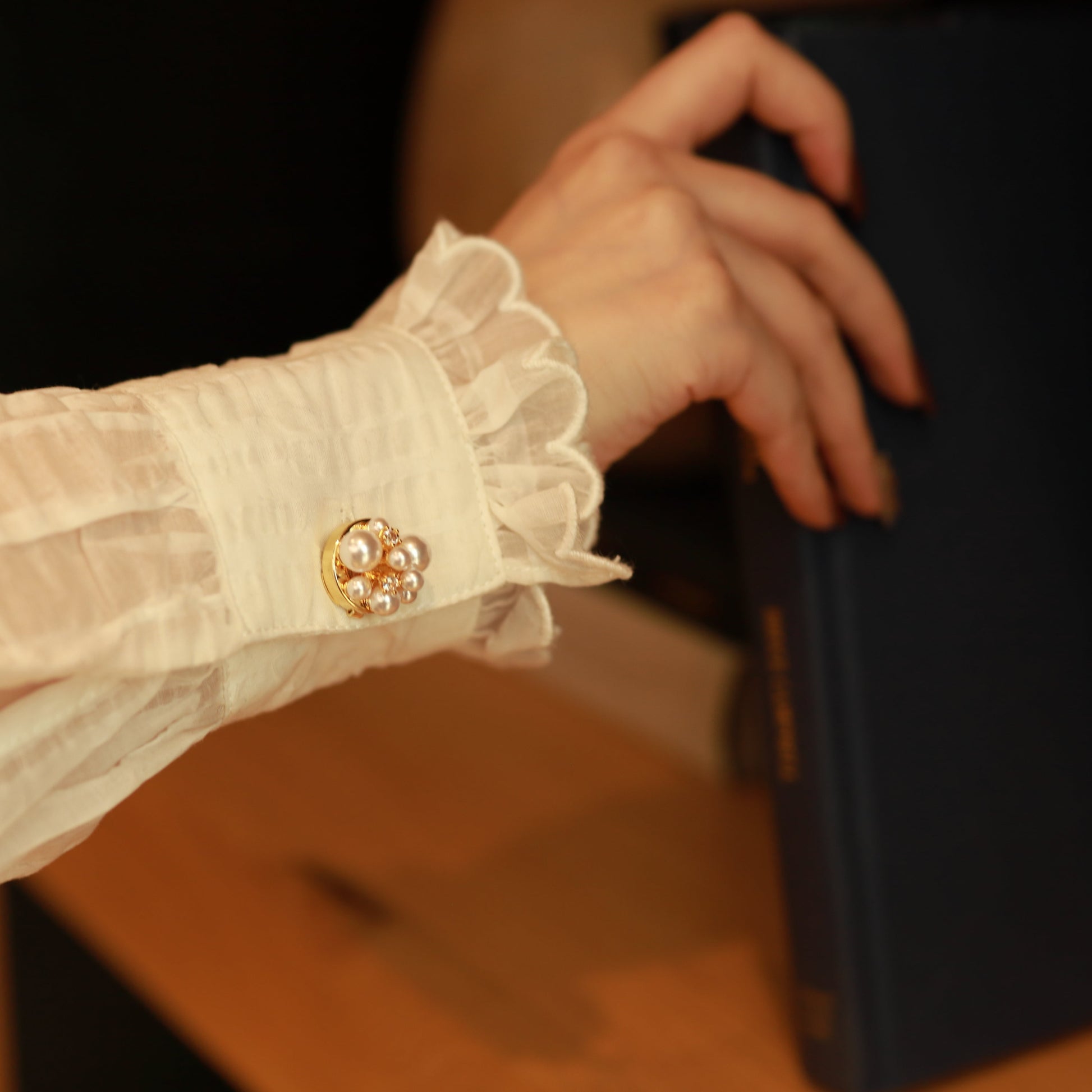 pearl constellation button cover on sleeve